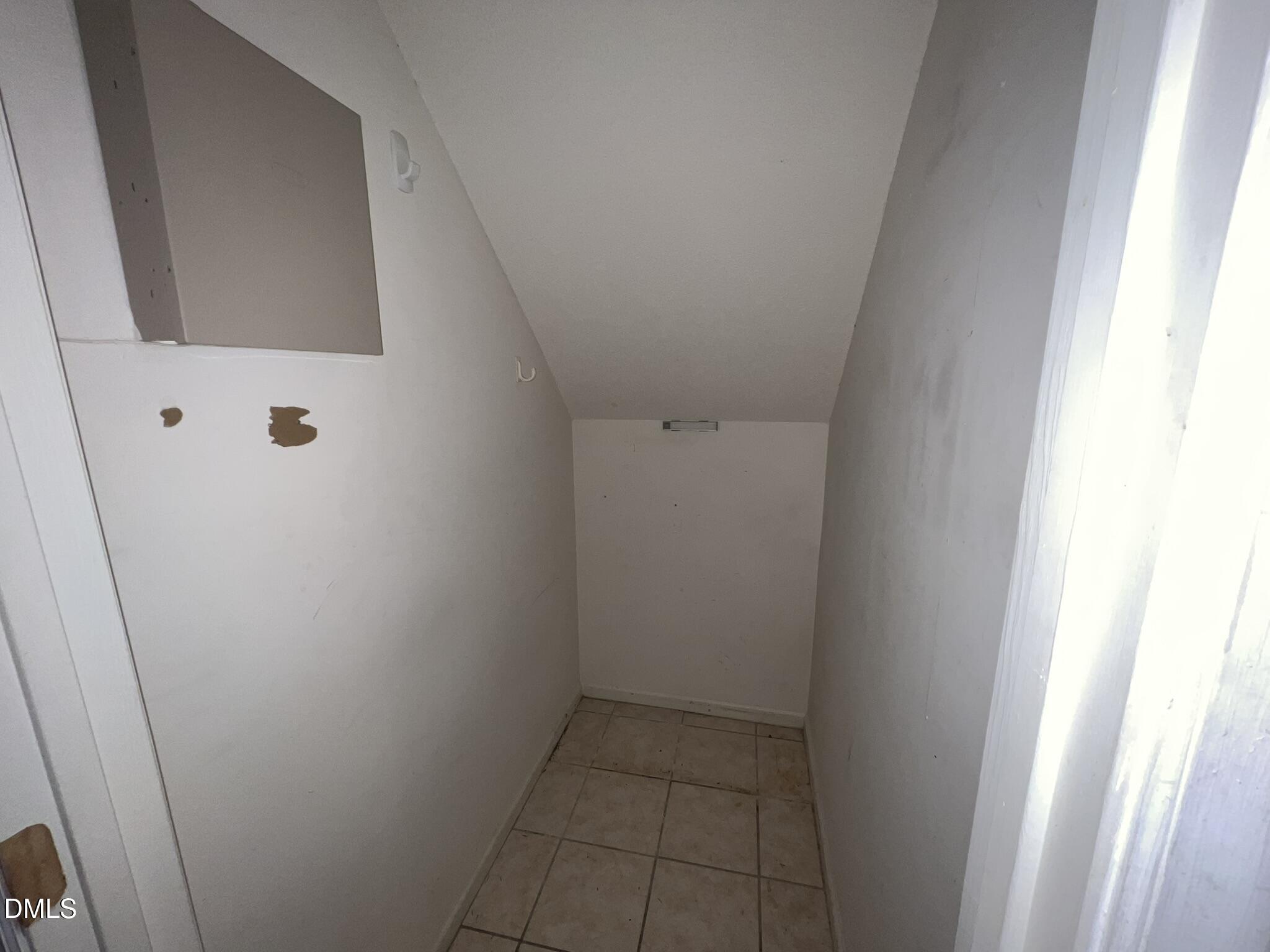 1016 Flower Round Court Raleigh, NC 27610 - Photo 5 of 23 Storage under stairs