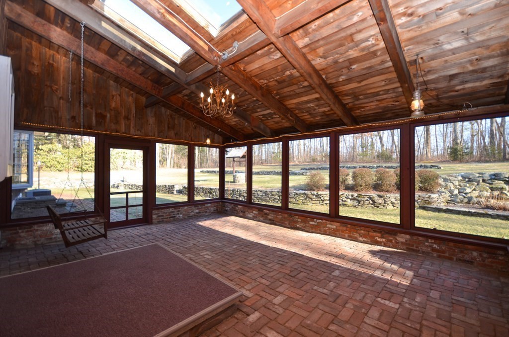 19 Butternut Drive Sutton, MA 01590 - Photo 18 of 33 a view of an empty room with wooden floor and a bed