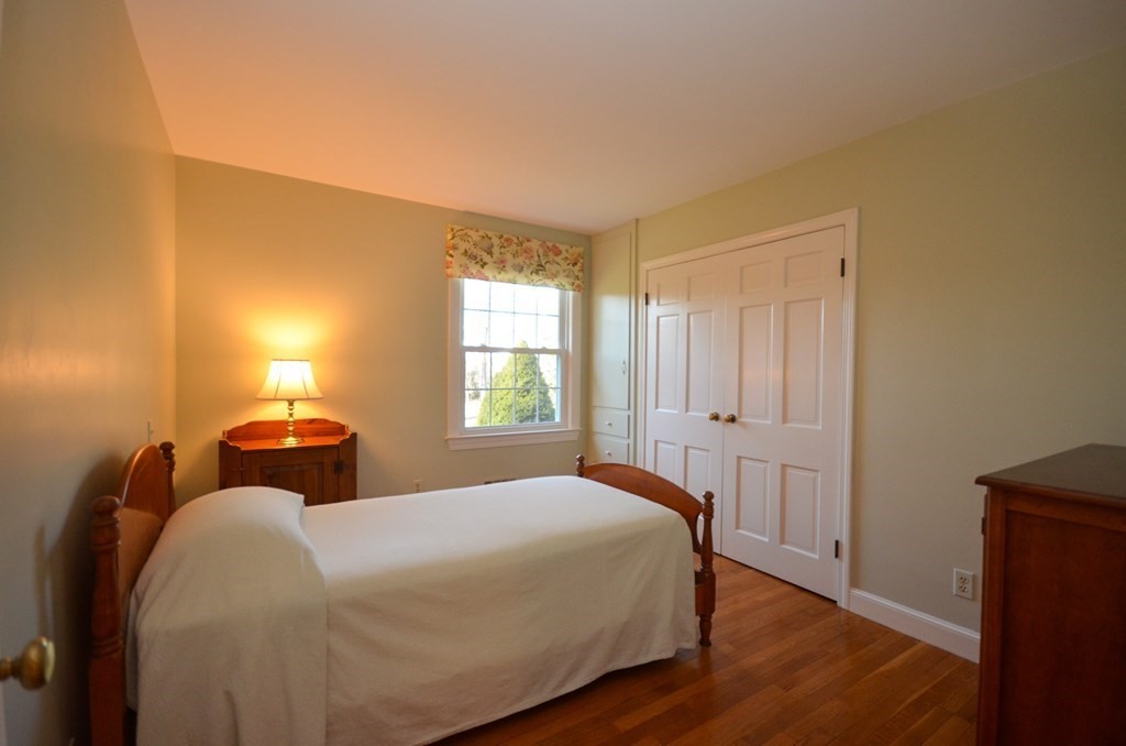 19 Butternut Drive Sutton, MA 01590 - Photo 19 of 33 a bedroom with a bed and a window