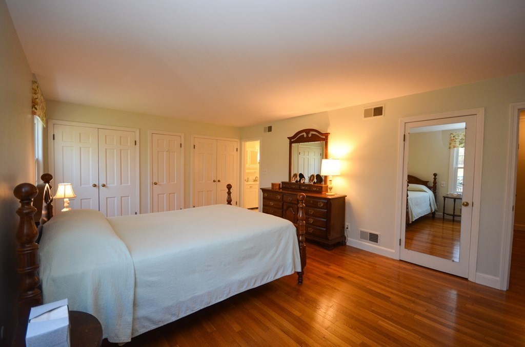 19 Butternut Drive Sutton, MA 01590 - Photo 23 of 33 a bedroom with a bed and a view of bathroom