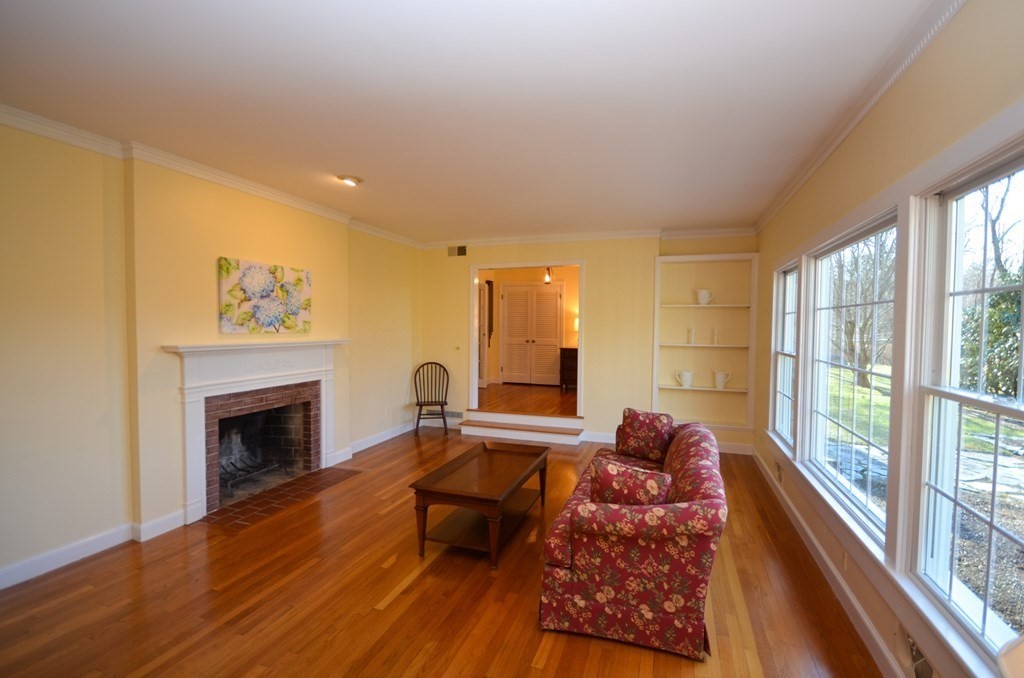 19 Butternut Drive Sutton, MA 01590 - Photo 7 of 33 a living room with furniture and a fireplace