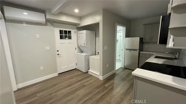 a view of a kitchen from the hallway