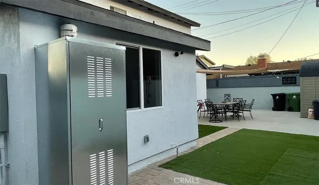 a bench sitting in front of a house