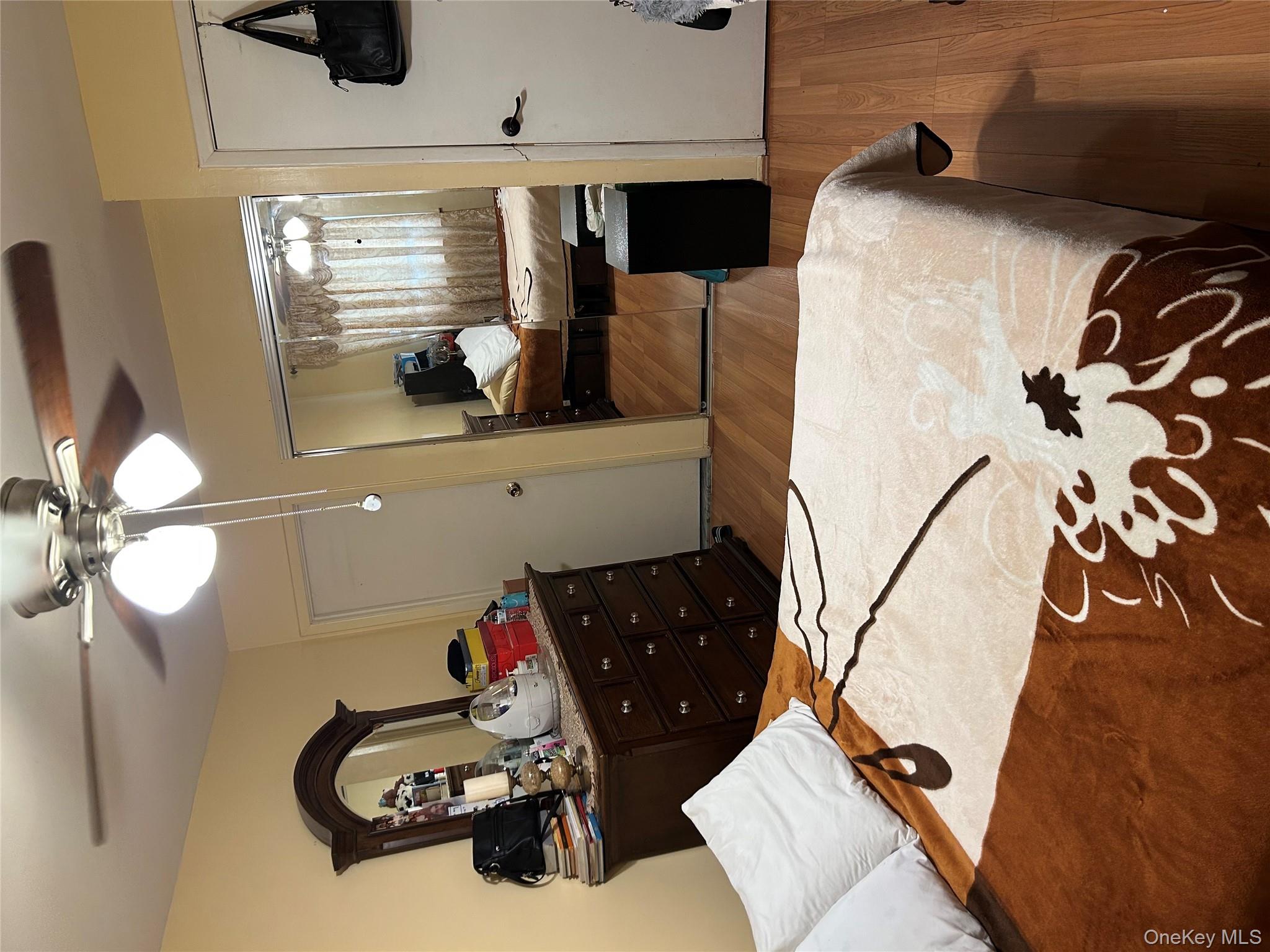 1285 Putnam Avenue Brooklyn, NY 11221 - Photo 4 of 8 Bedroom featuring light wood finished floors, ceiling fan, and a closet