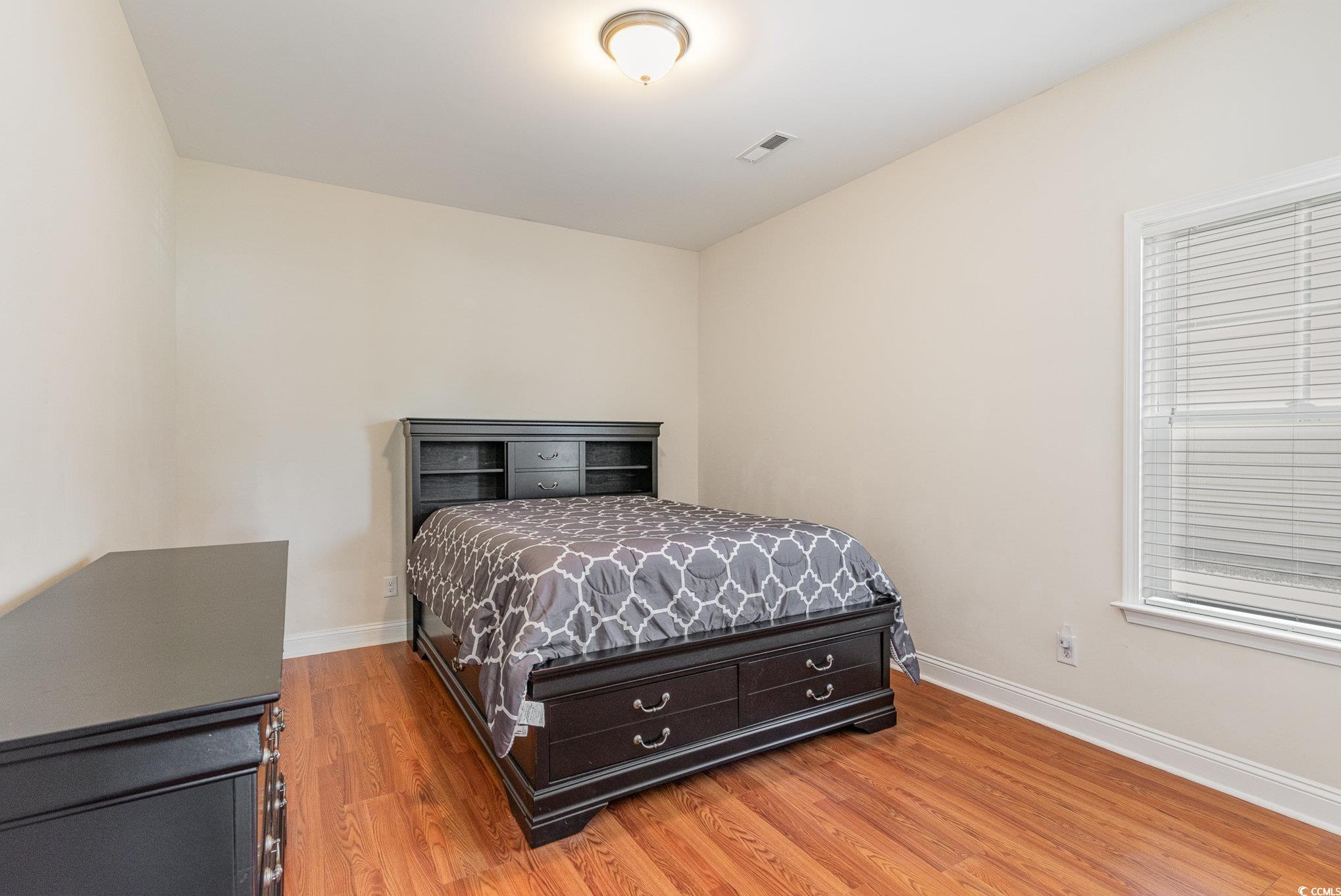 321 Cabo Loop Myrtle Beach, SC 29588 - Photo 14 of 25 Bedroom with light wood-style flooring, visible ve