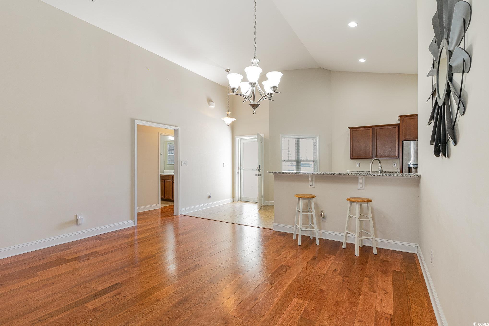 321 Cabo Loop Myrtle Beach, SC 29588 - Photo 3 of 25 Kitchen featuring high vaulted ceiling, light wood