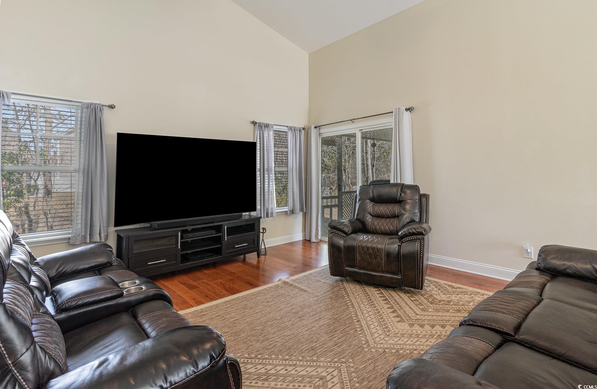 321 Cabo Loop Myrtle Beach, SC 29588 - Photo 4 of 25 Living area featuring baseboards, high vaulted cei