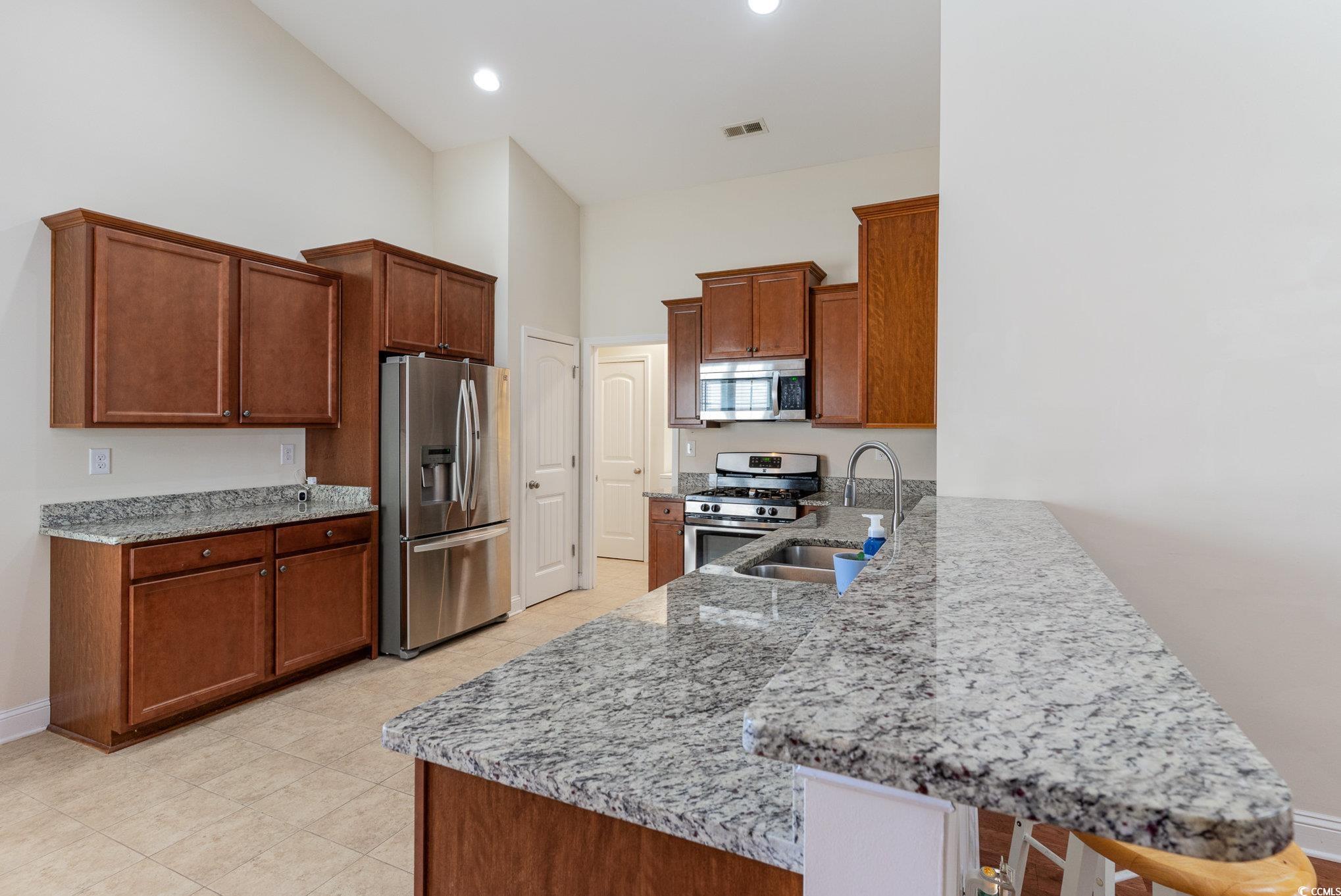 321 Cabo Loop Myrtle Beach, SC 29588 - Photo 7 of 25 Kitchen with stainless steel appliances, light sto