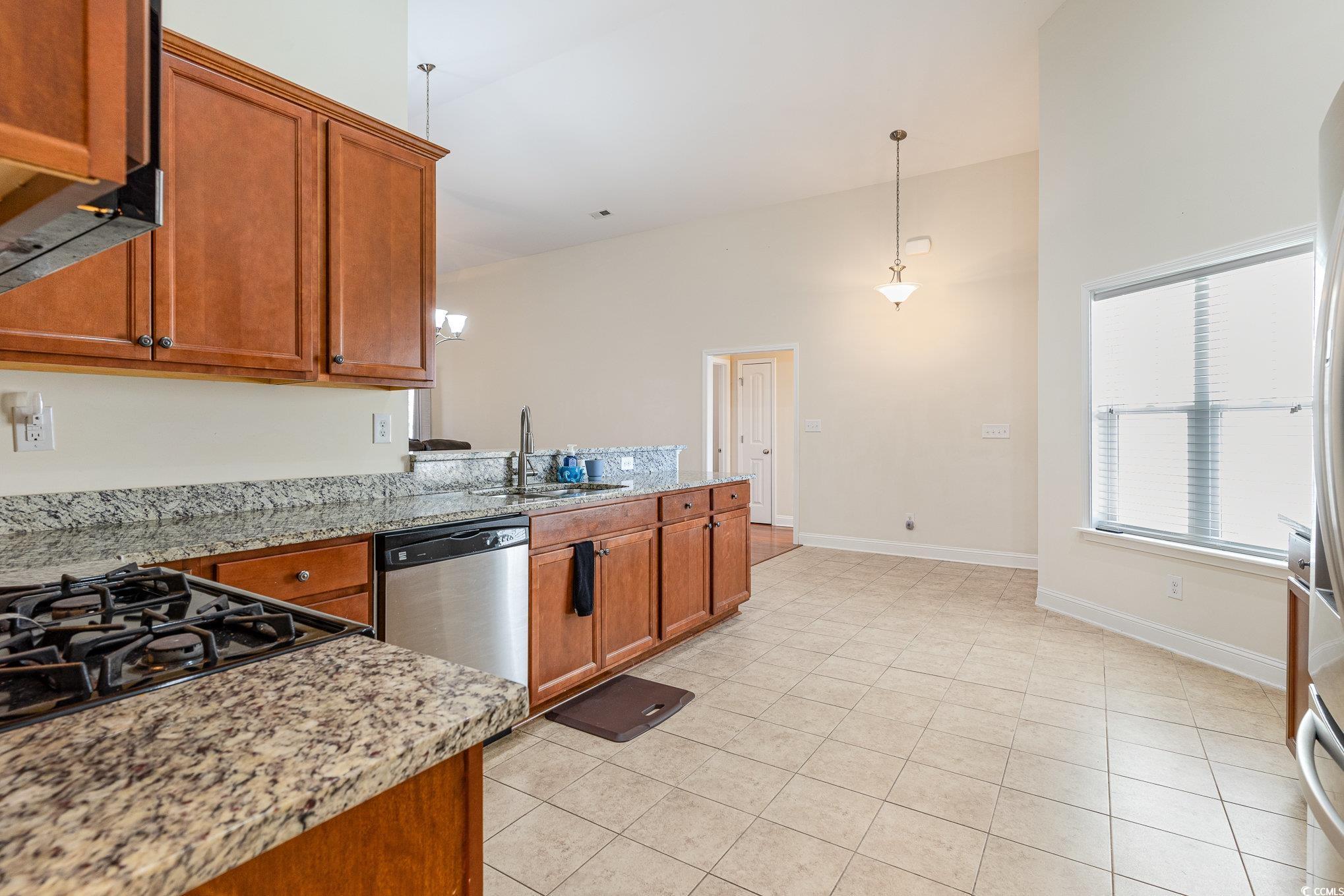 321 Cabo Loop Myrtle Beach, SC 29588 - Photo 8 of 25 Kitchen with a peninsula, stainless steel dishwash