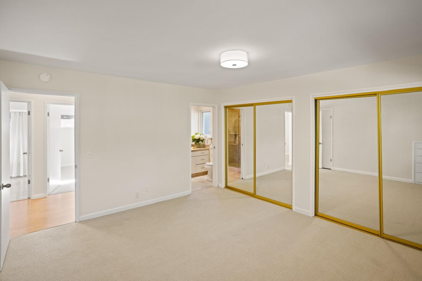 3112 Stevenson Drive Pebble Beach, CA 93953 - Photo 21 of 47 an empty room with closet and a sliding door