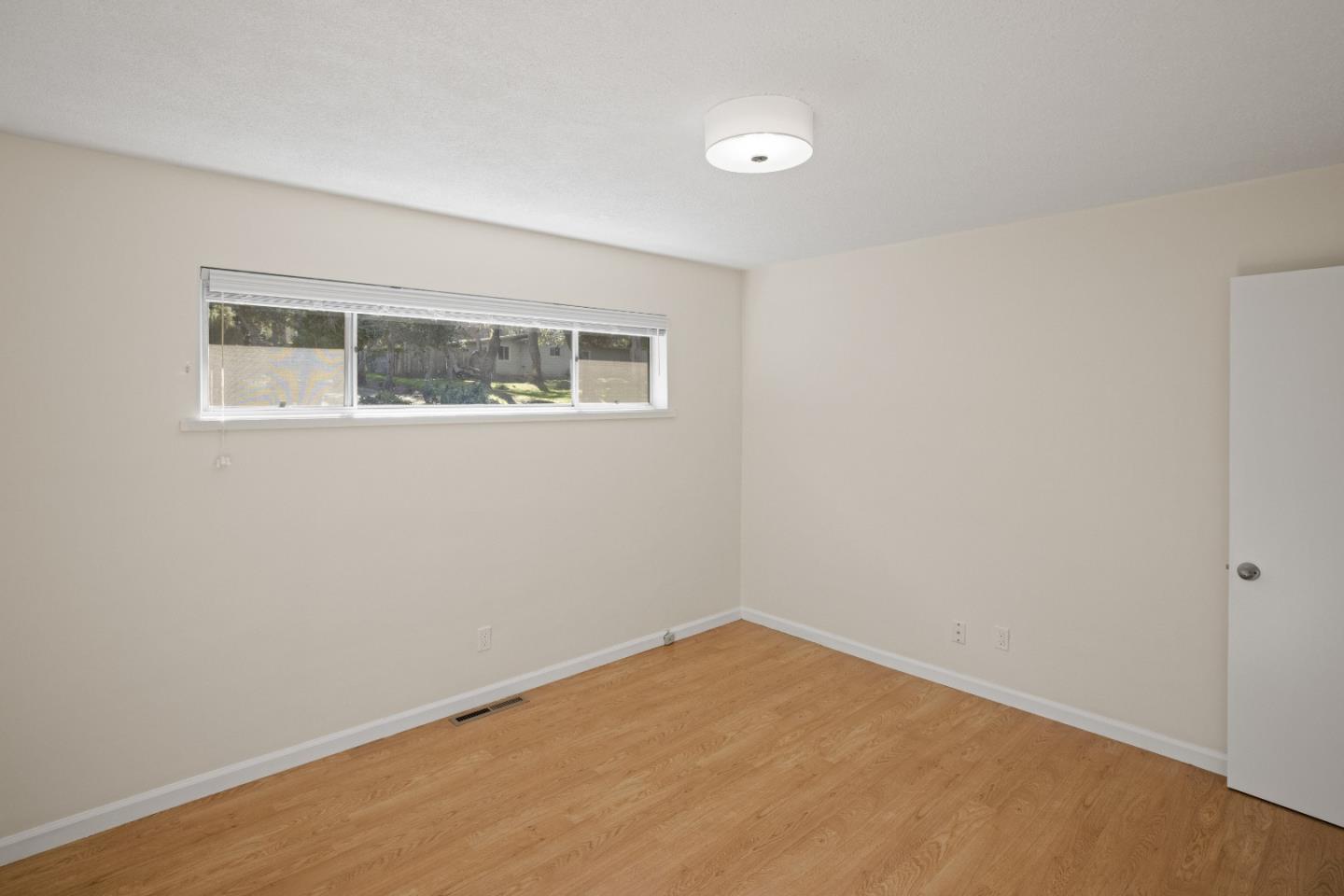 3112 Stevenson Drive Pebble Beach, CA 93953 - Photo 27 of 47 a view of a big room with wooden floor and windows