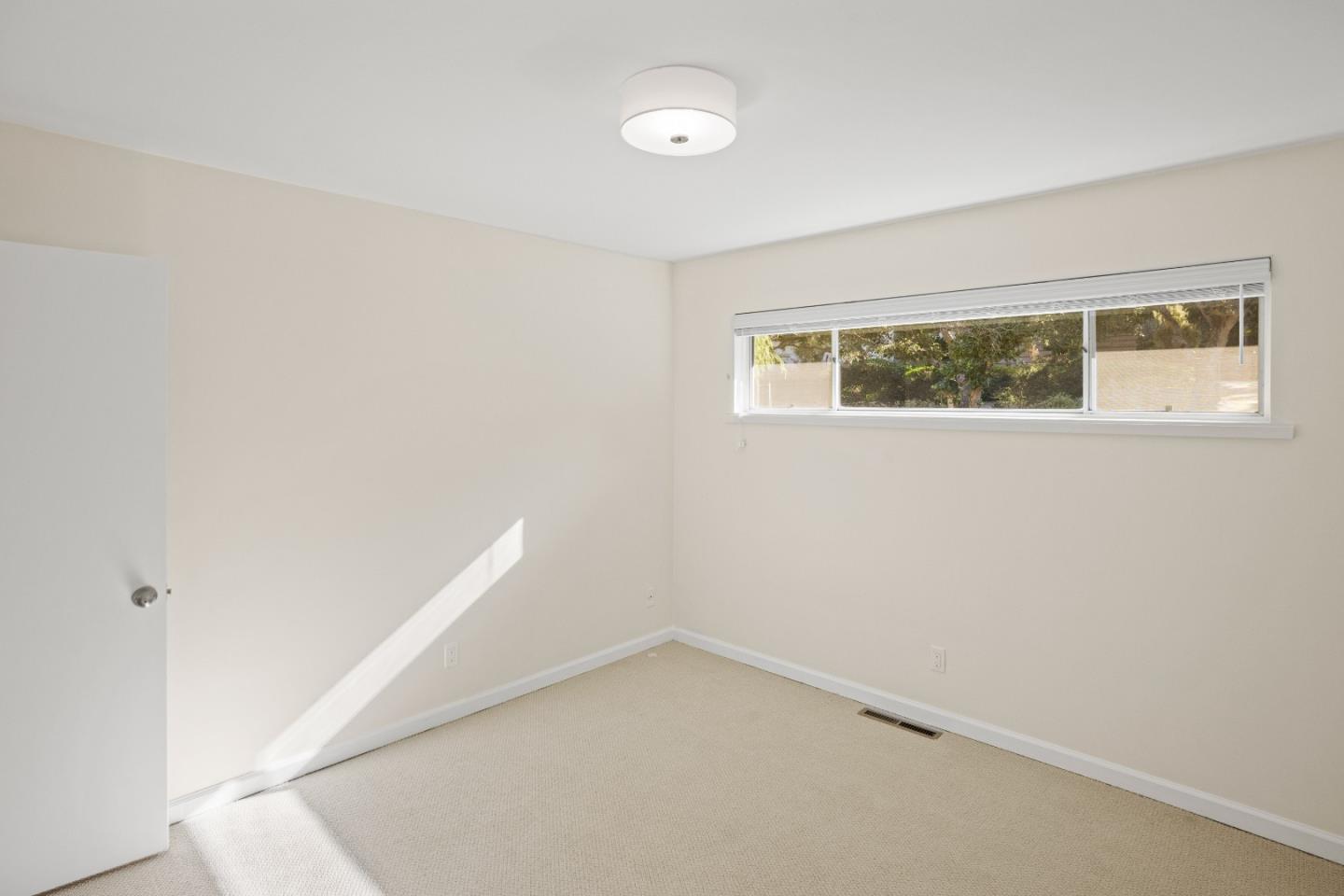 3112 Stevenson Drive Pebble Beach, CA 93953 - Photo 32 of 47 a view of an empty room with a window