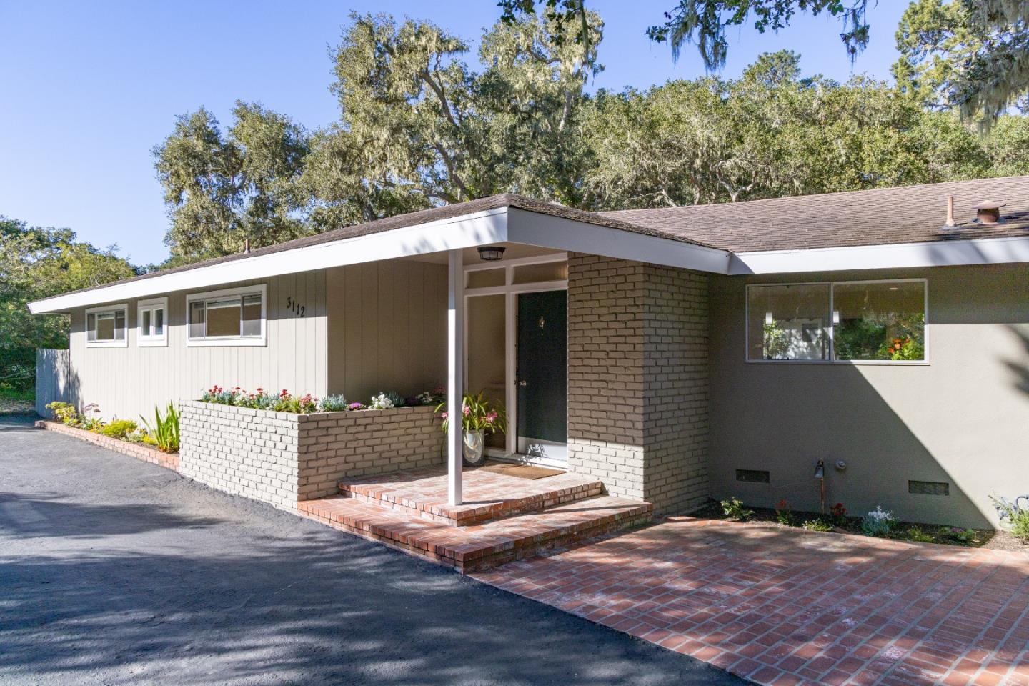 3112 Stevenson Drive Pebble Beach, CA 93953 - Photo 41 of 47 a front view of a house with a garage