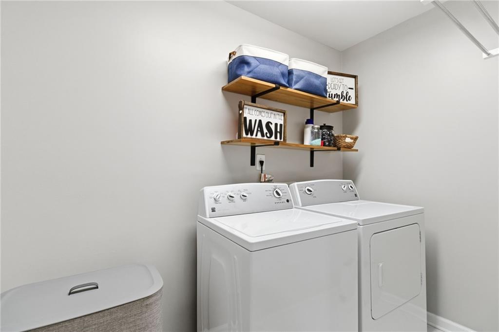 203 River Green Avenue Canton, GA 30114 - Photo 17 of 28 a utility room with dryer and washer