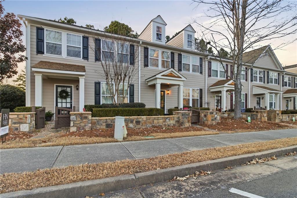 203 River Green Avenue Canton, GA 30114 - Photo 2 of 28 a front view of a building with street