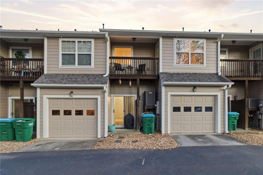 203 River Green Avenue Canton, GA 30114 - Photo 23 of 28 a front view of a house with a garage