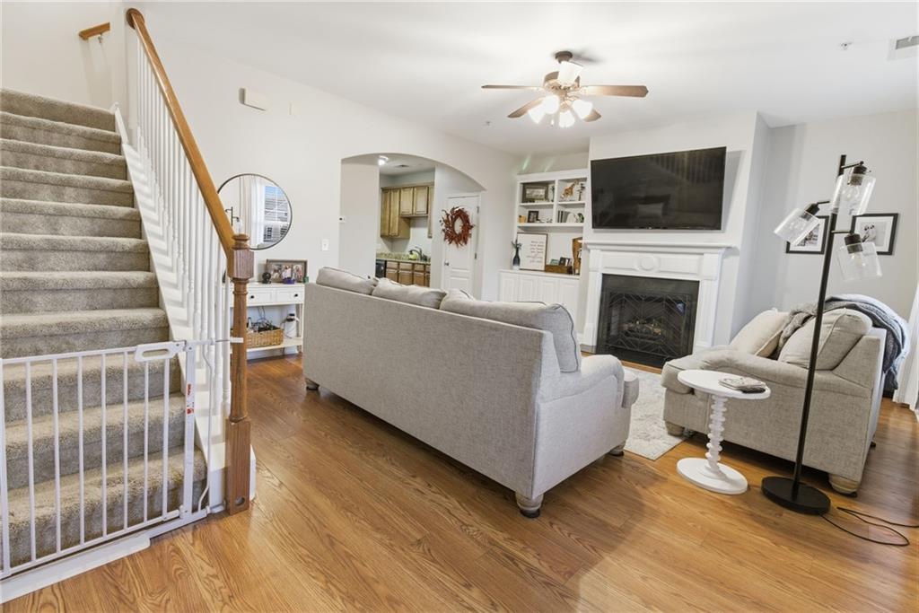 203 River Green Avenue Canton, GA 30114 - Photo 4 of 28 a living room with furniture and a fireplace