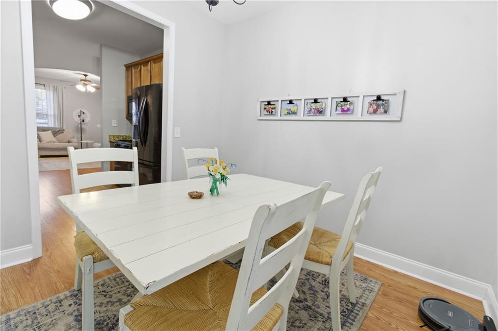 203 River Green Avenue Canton, GA 30114 - Photo 9 of 28 a view of a dining room with furniture