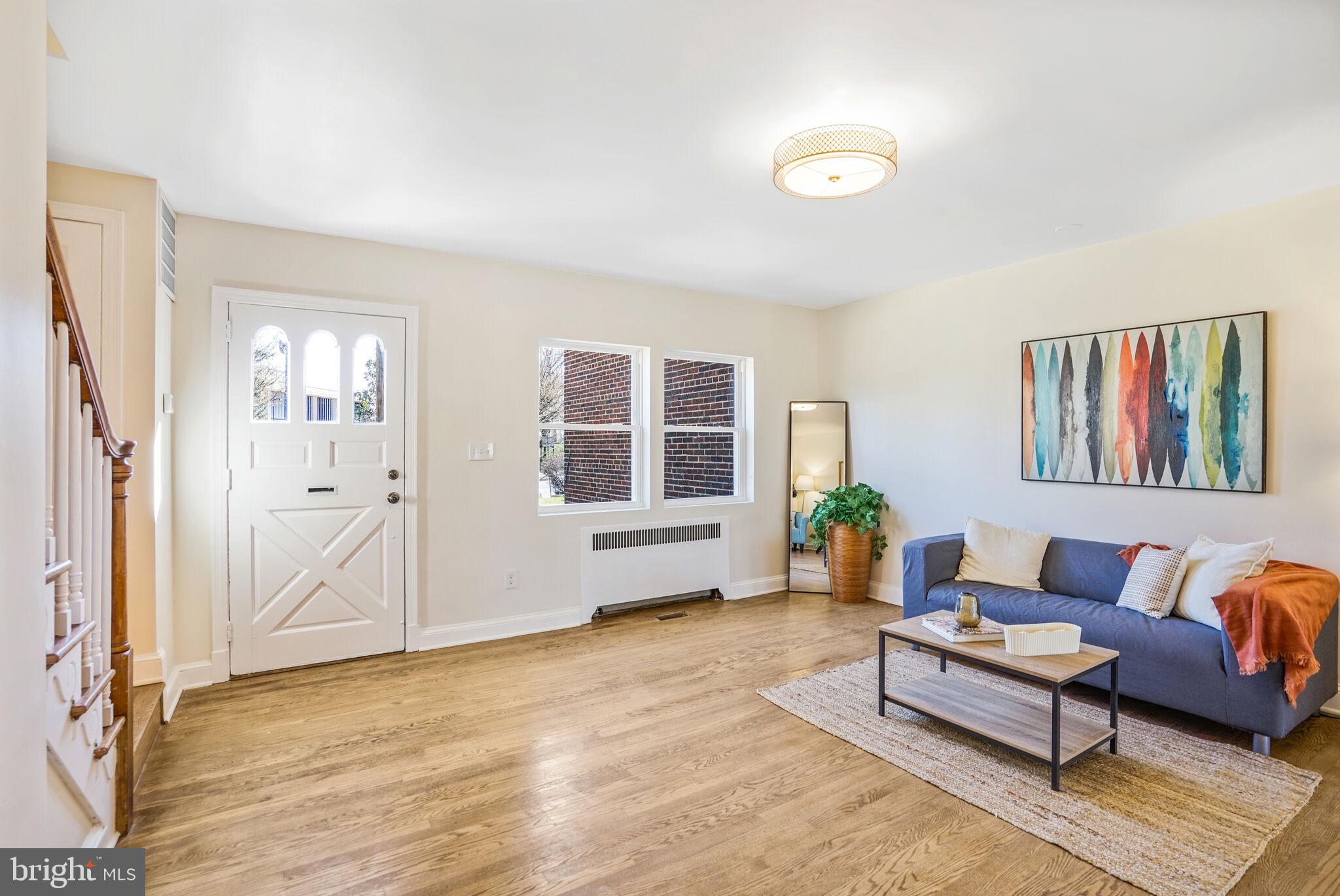 53 Franklin Street Northeast Washington, DC 20002 - Photo 11 of 33 a living room with furniture and wooden floor