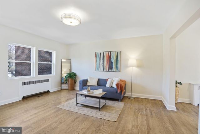 a living room with furniture and windows