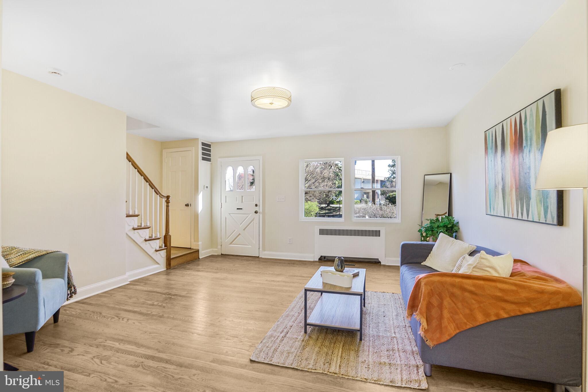 53 Franklin Street Northeast Washington, DC 20002 - Photo 13 of 33 a bedroom with furniture and a large window