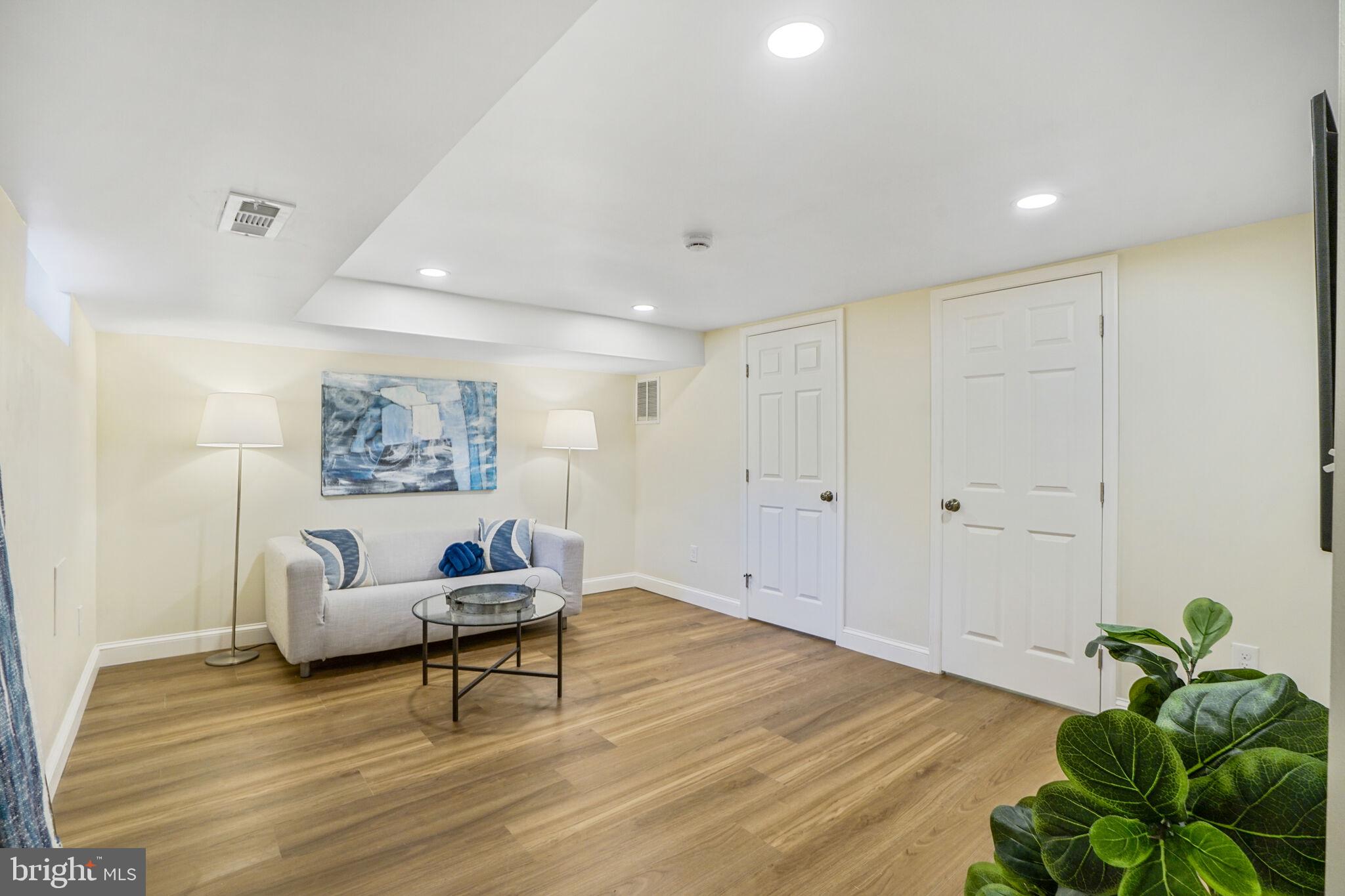 53 Franklin Street Northeast Washington, DC 20002 - Photo 21 of 33 a living room with furniture and a potted plant