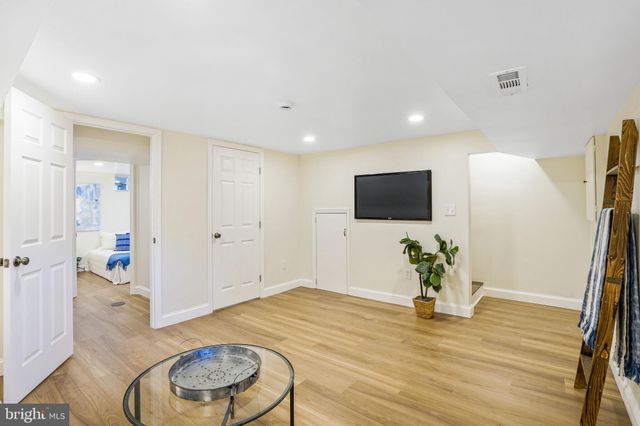 a view of a livingroom with furniture and wooden floor