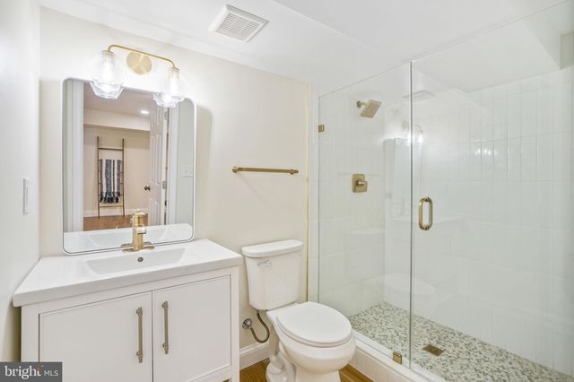 a view of a hallway with washer and dryer