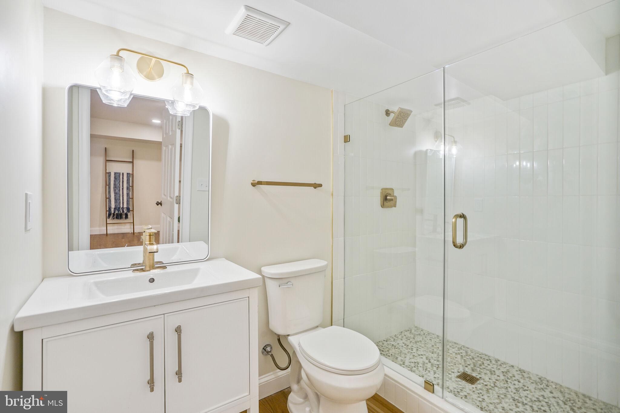 53 Franklin Street Northeast Washington, DC 20002 - Photo 25 of 33 a bathroom with a sink a toilet and shower