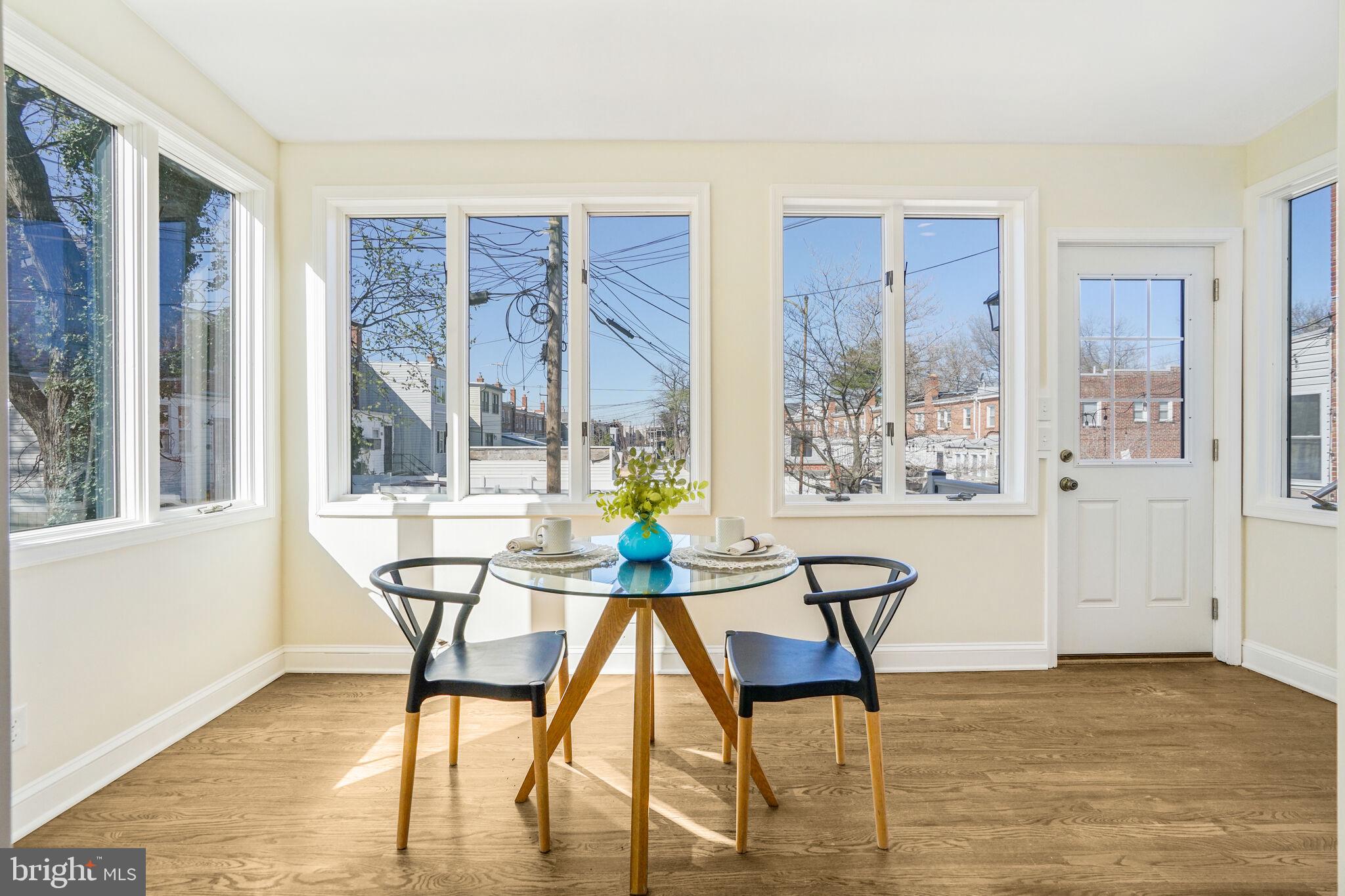 53 Franklin Street Northeast Washington, DC 20002 - Photo 7 of 33 a view of a dining room with furniture large windows and wooden floor