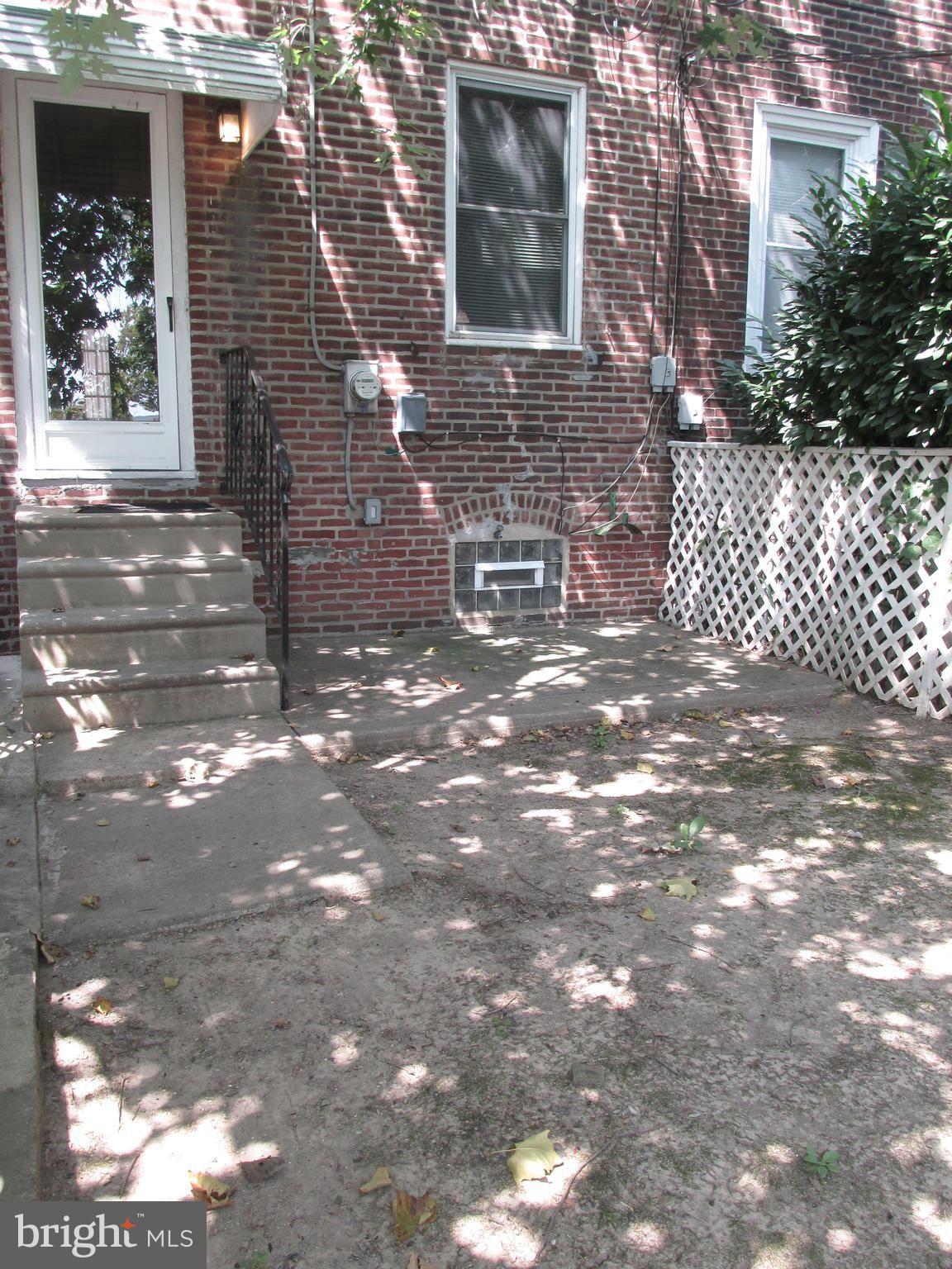 6101 Colgate Street Philadelphia, PA 19111 - Photo 37 of 39 a view of a brick house with a tree