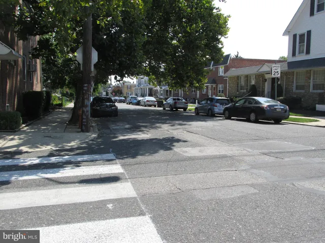 a view of street with parked cars
