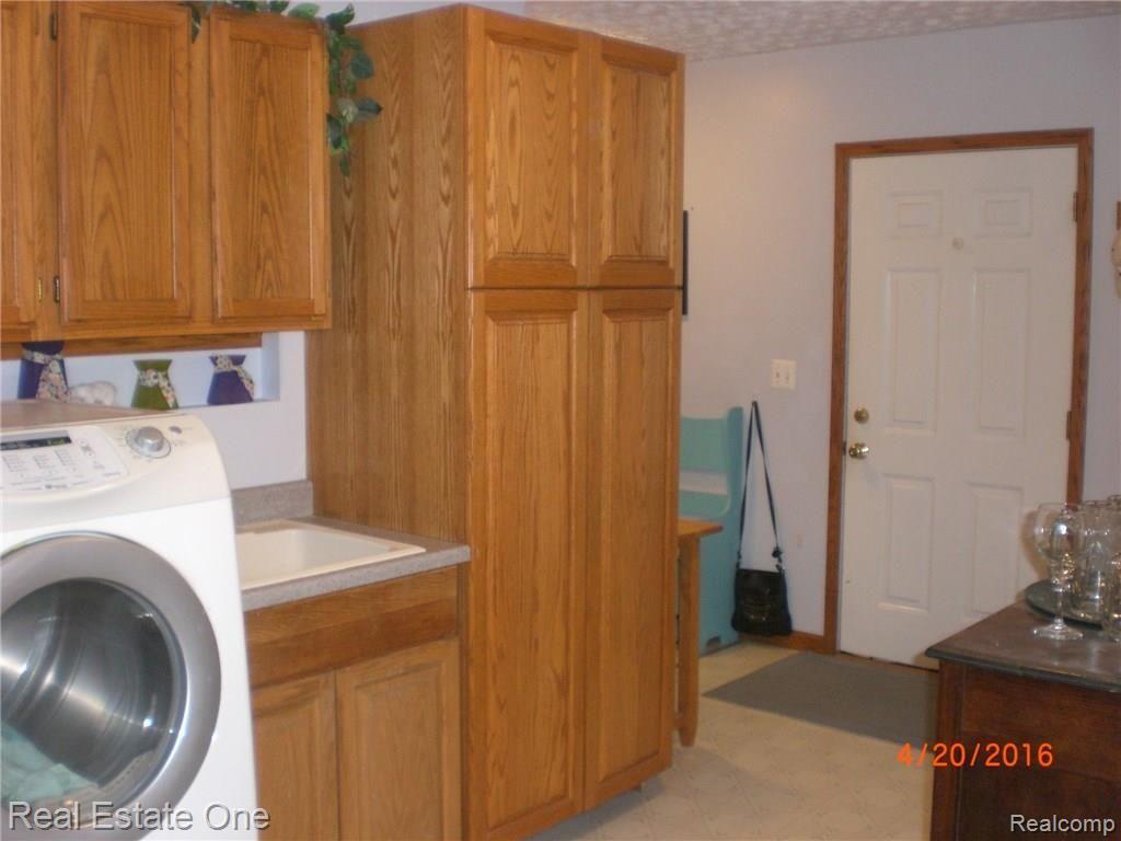 26523 25 Mile Road New Baltimore, MI 48051 - Photo 35 of 37 Laundry area with storage