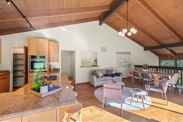 a living room with lots of furniture and a chandelier