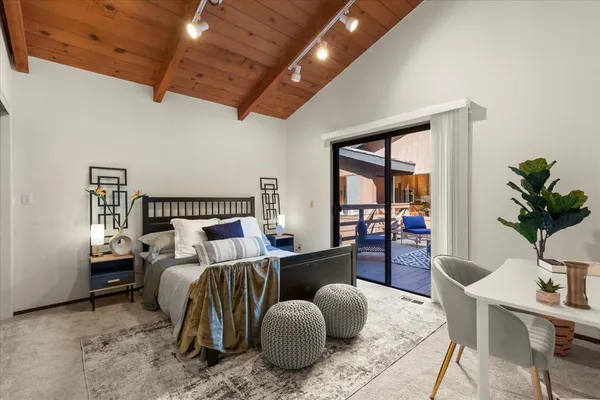 a bedroom with furniture and a wooden floor