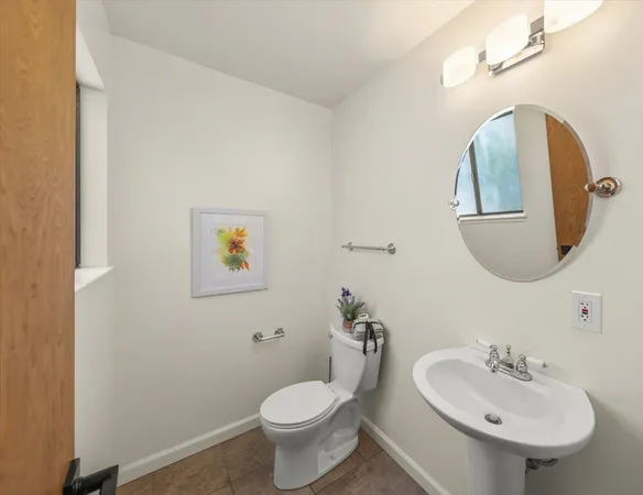 a bathroom with 2 sink and a mirror