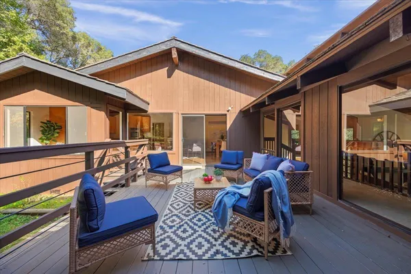 a outdoor living space with furniture and city view