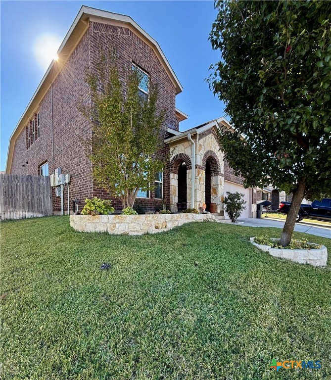 2508 Legacy Lane Killeen, TX 76549 - Photo 2 of 17 a front view of a house with garden