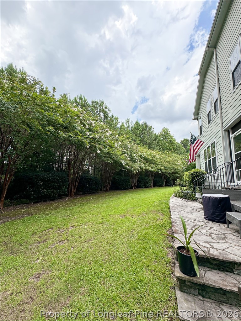 93 Falcon Ridge Drive Spring Lake, NC 28390 - Photo 50 of 50 a view of backyard with seating area and trees