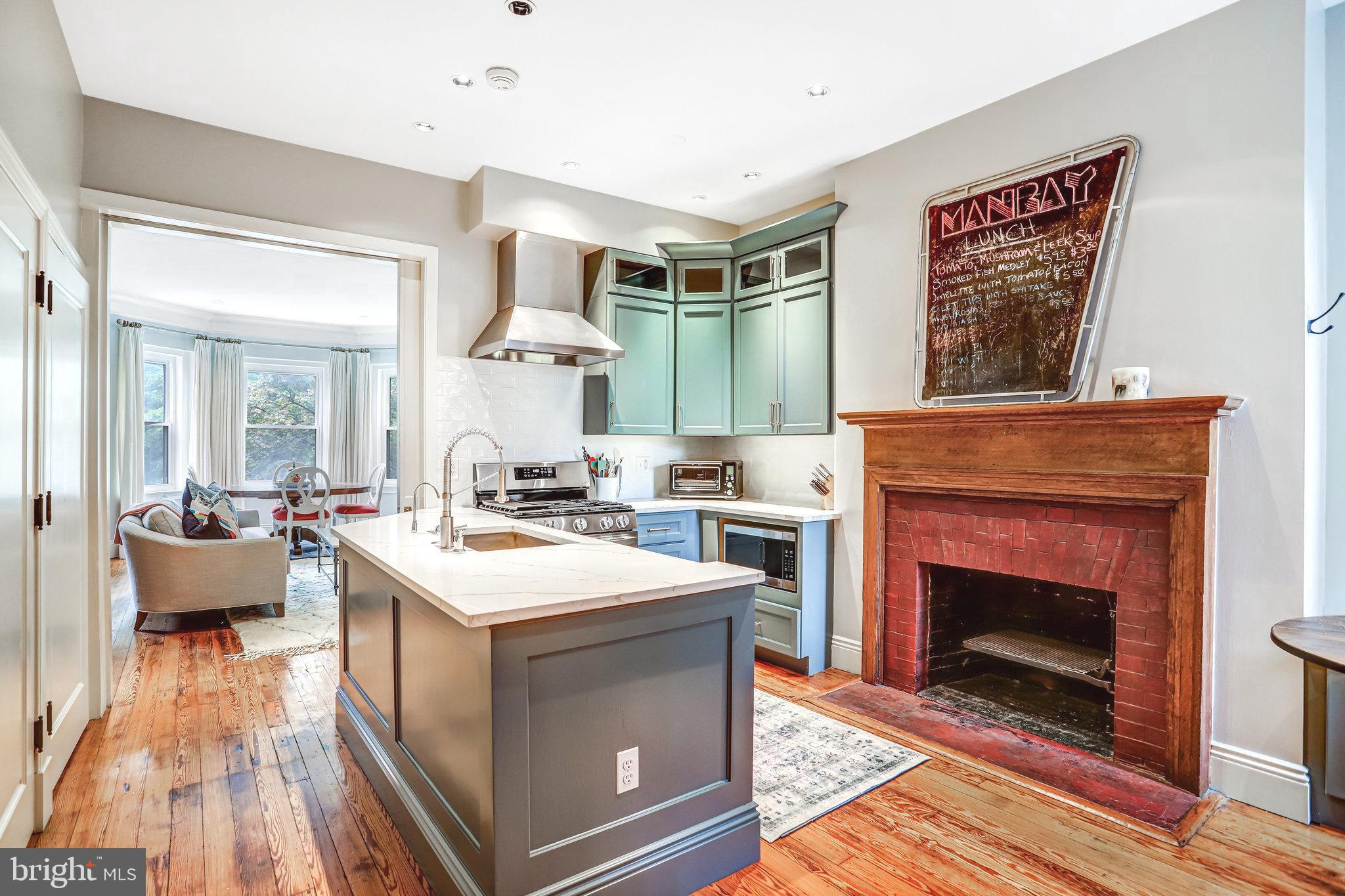 1820 Kalorama Road Northwest, Unit 3 Washington, DC 20009 - Photo 11 of 32 a living room with stainless steel appliances furniture a fireplace and a fireplace