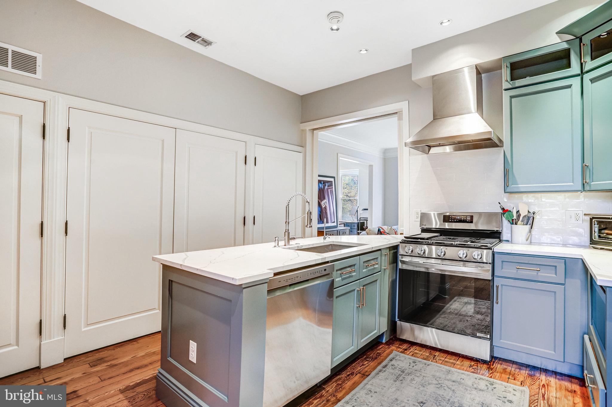 1820 Kalorama Road Northwest, Unit 3 Washington, DC 20009 - Photo 13 of 32 a kitchen with a stove and a sink