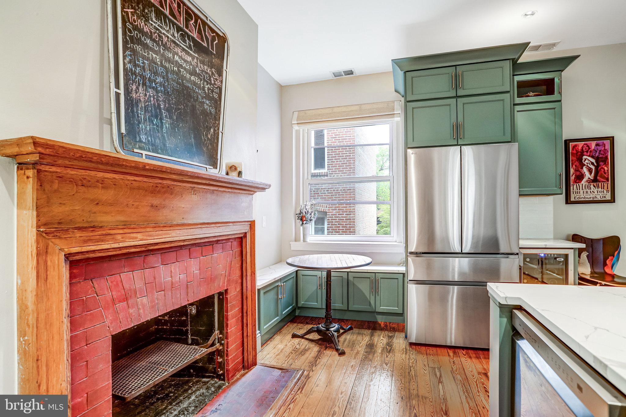 1820 Kalorama Road Northwest, Unit 3 Washington, DC 20009 - Photo 15 of 32 a living room with a fireplace and a table