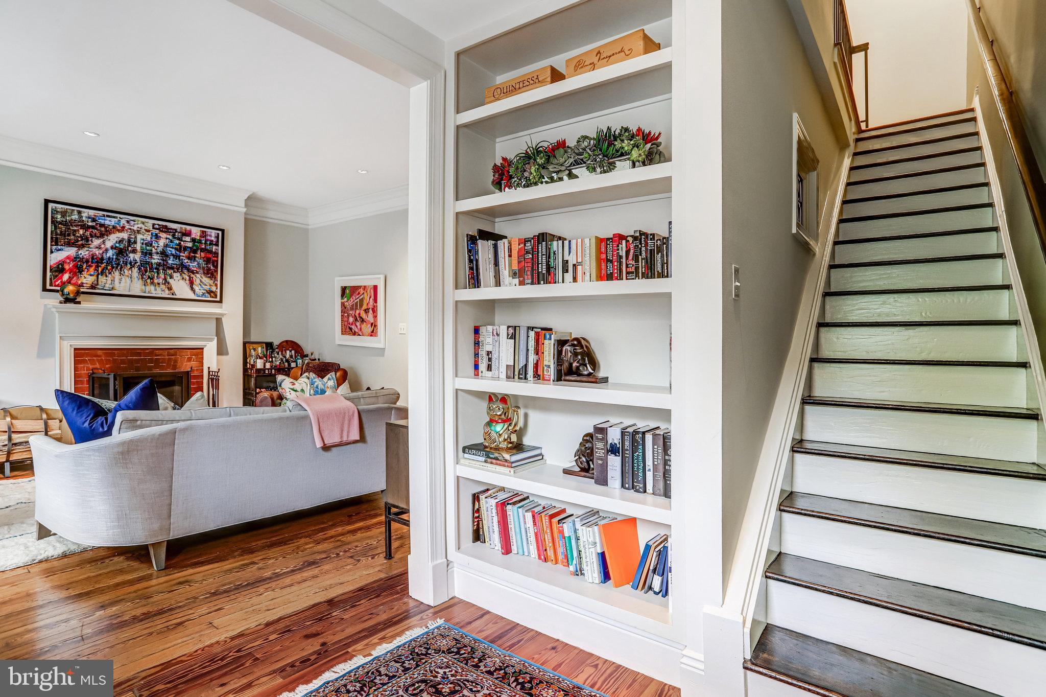1820 Kalorama Road Northwest, Unit 3 Washington, DC 20009 - Photo 19 of 32 a living room with furniture and a book shelf