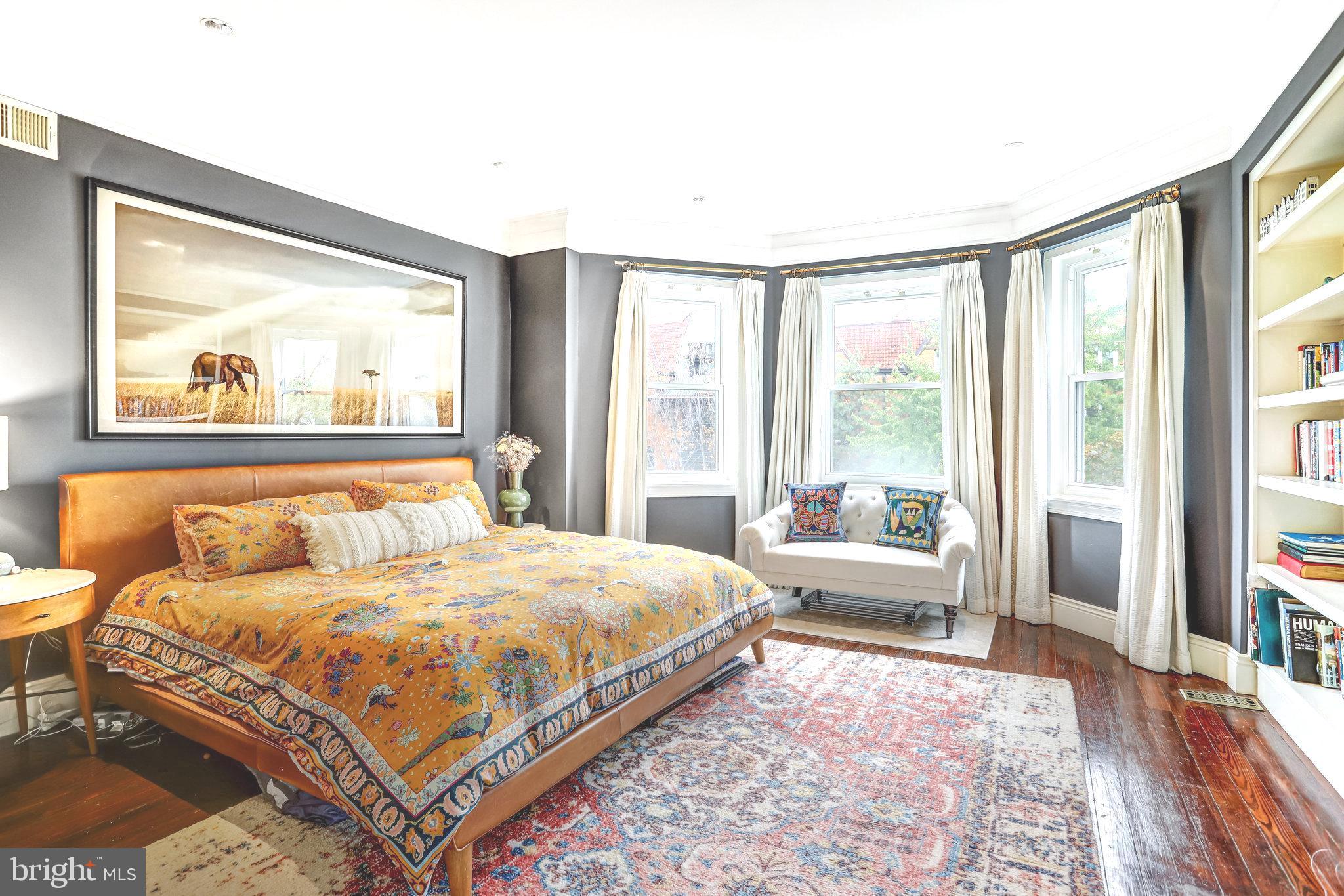 1820 Kalorama Road Northwest, Unit 3 Washington, DC 20009 - Photo 20 of 32 a bedroom with a large bed and a large window