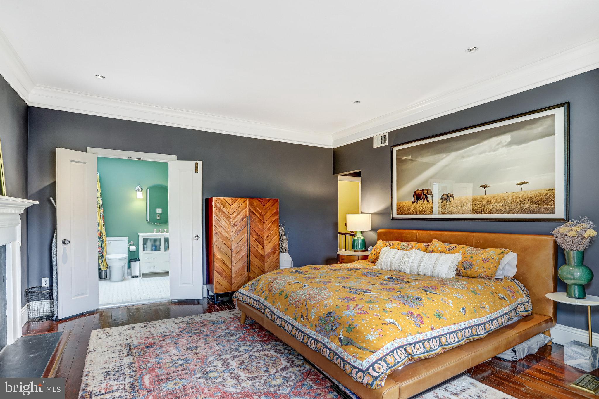 1820 Kalorama Road Northwest, Unit 3 Washington, DC 20009 - Photo 22 of 32 a bedroom with a bed and glass windows