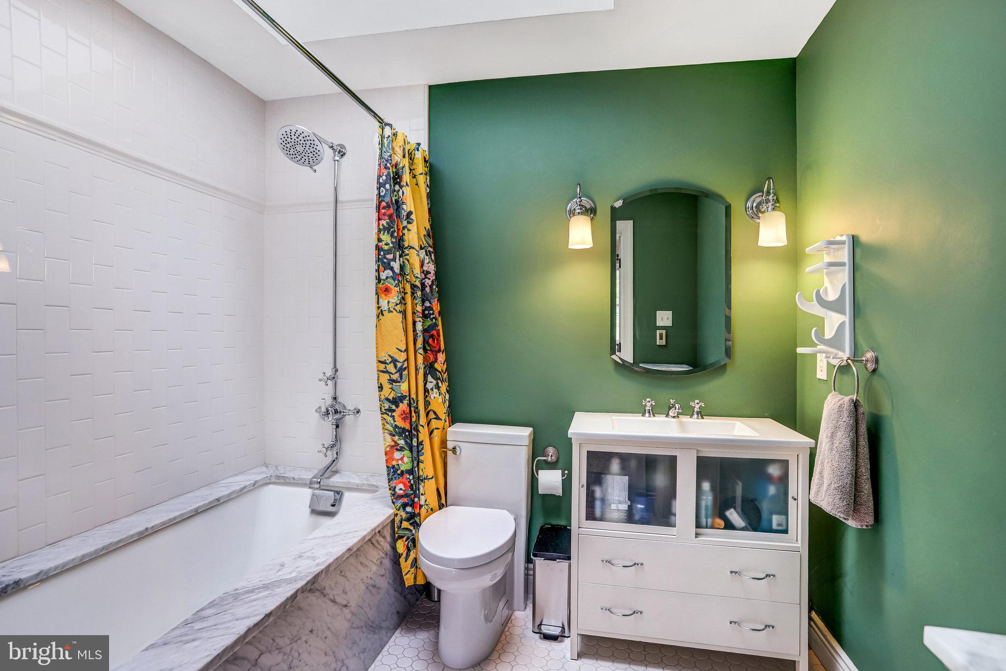 1820 Kalorama Road Northwest, Unit 3 Washington, DC 20009 - Photo 23 of 32 a bathroom with a toilet a sink and bathtub
