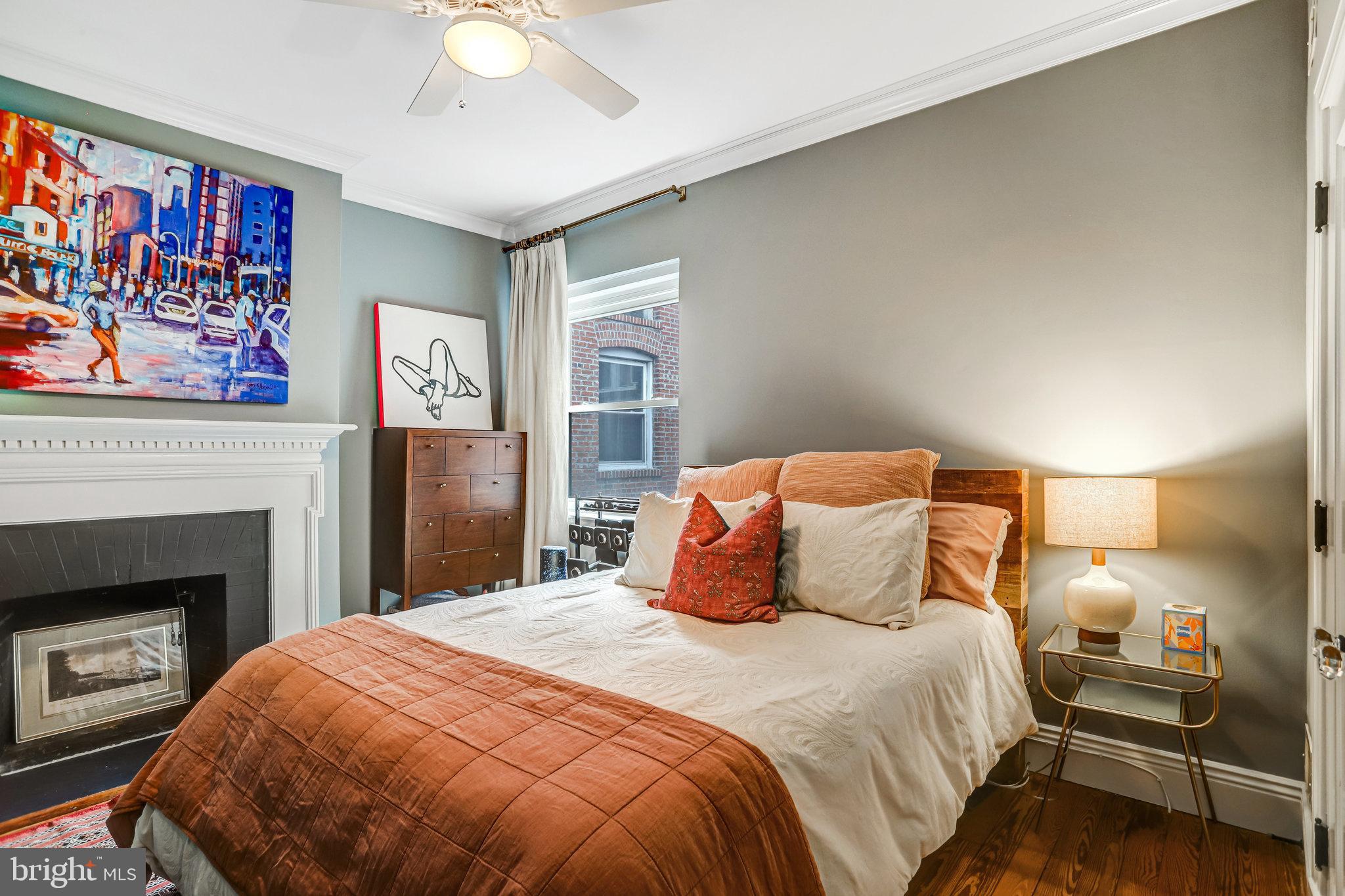 1820 Kalorama Road Northwest, Unit 3 Washington, DC 20009 - Photo 26 of 32 a bedroom with a bed and a lamp