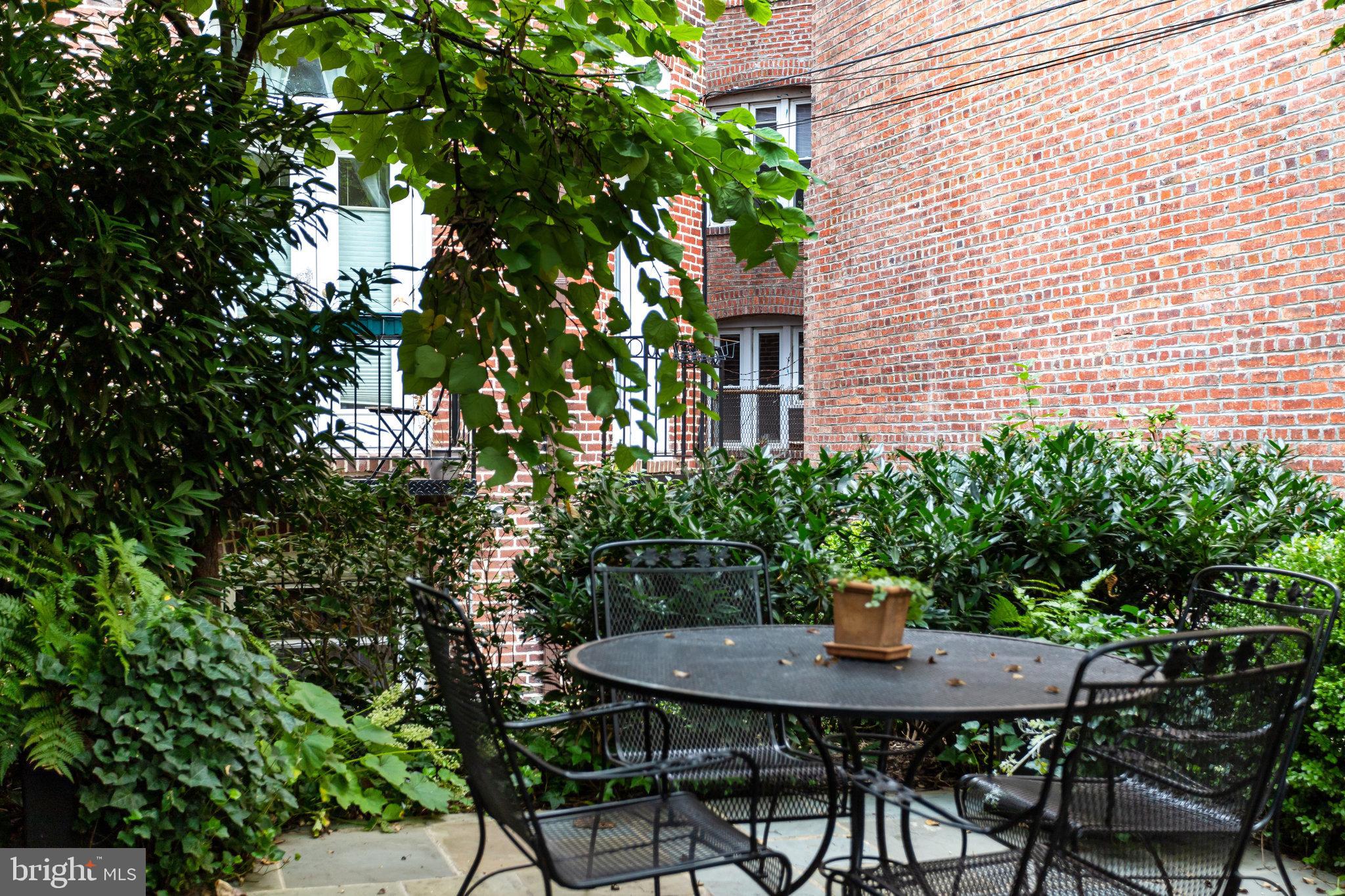 1820 Kalorama Road Northwest, Unit 3 Washington, DC 20009 - Photo 29 of 32 a view of a backyard with a patio and plants