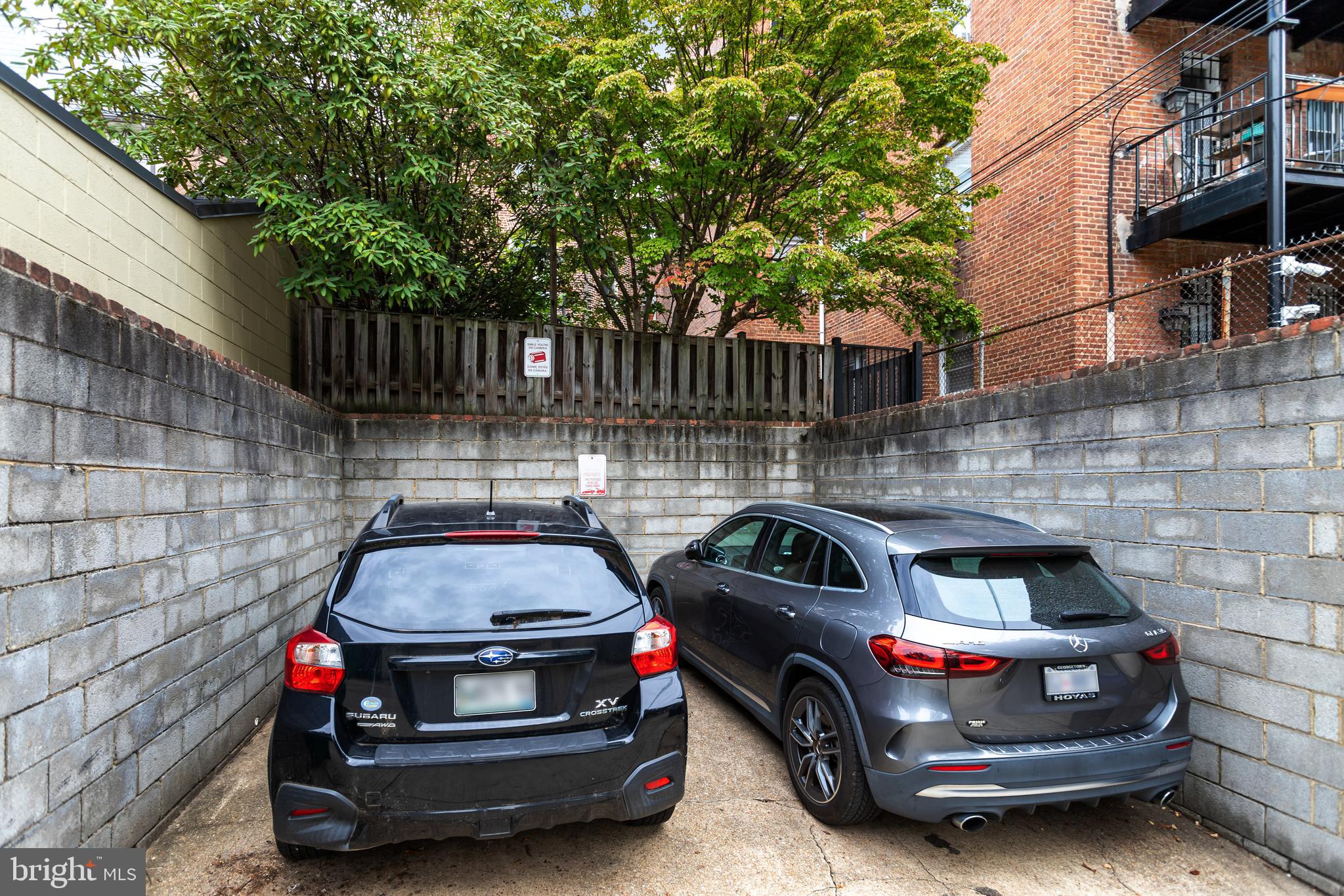 1820 Kalorama Road Northwest, Unit 3 Washington, DC 20009 - Photo 31 of 32 a car parked in front of a brick house
