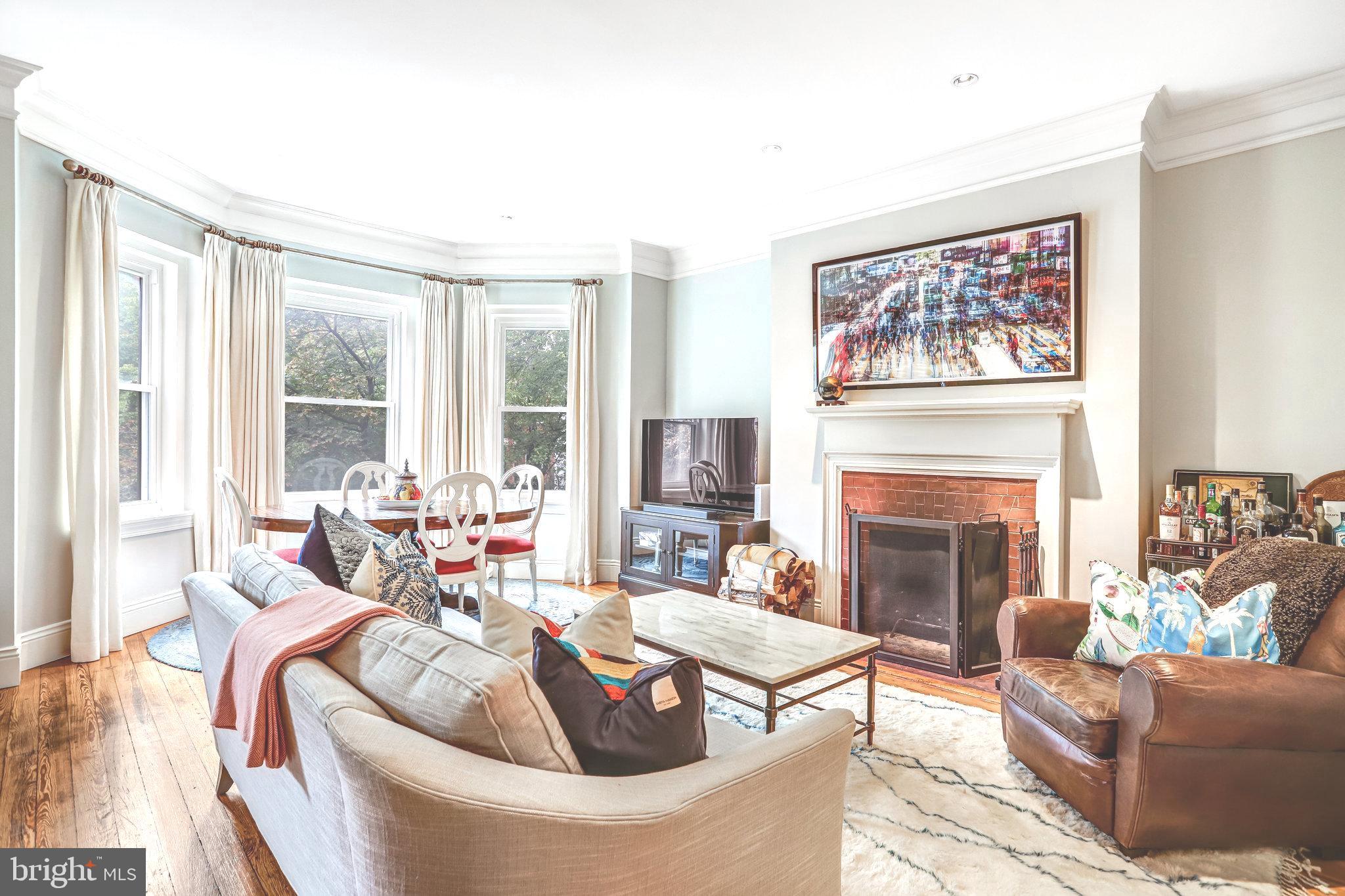 1820 Kalorama Road Northwest, Unit 3 Washington, DC 20009 - Photo 4 of 32 a living room with furniture and a fireplace